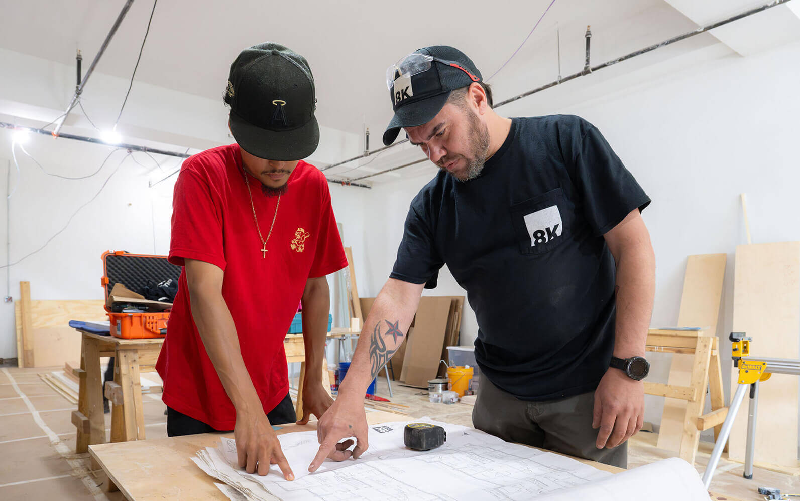 Looking at floor plans at job site